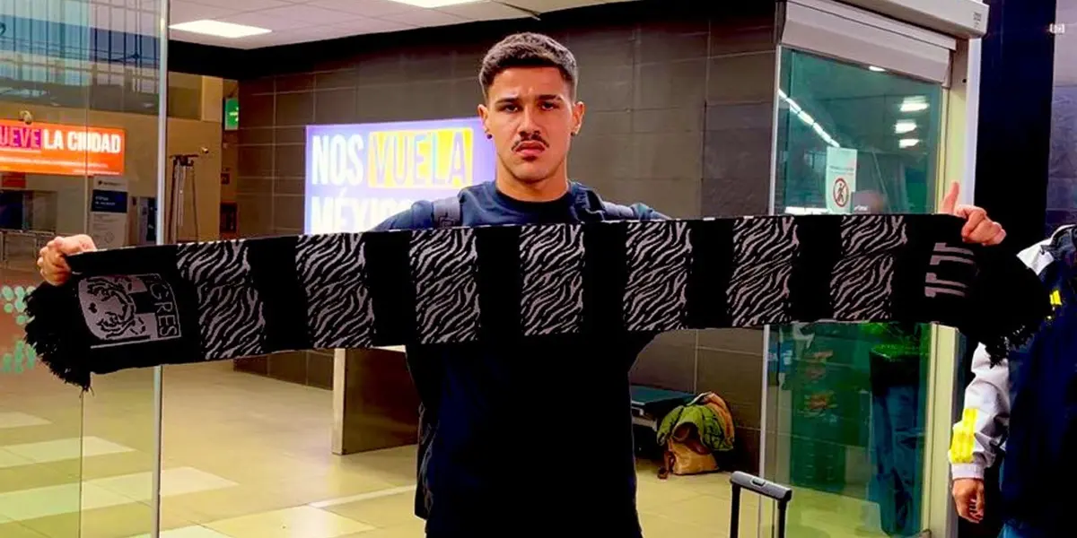 Rómulo con la bufanda de Tigres